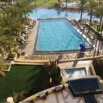 Aerial view of artificial turf beside the resort pool at Omni Amelia Island