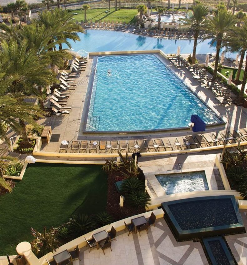 Aerial view of artificial turf beside the resort pool at Omni Amelia Island